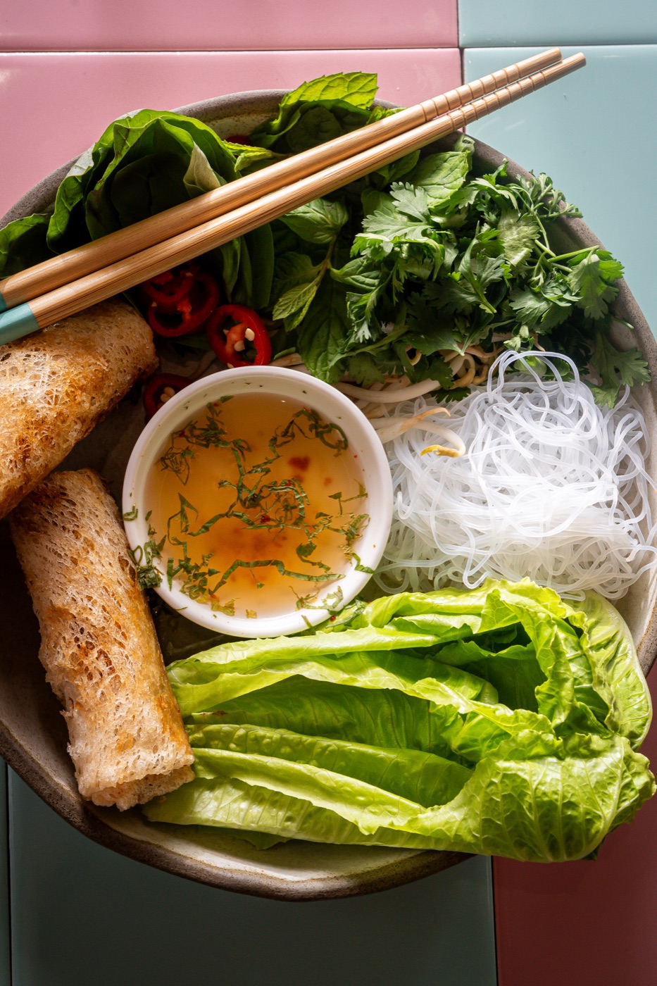 Vietnamese bowl with spring rolls