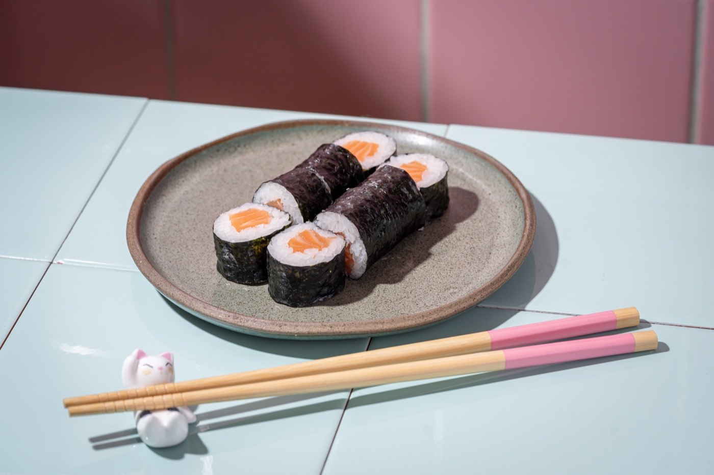 Sushi rolls with chopsticks